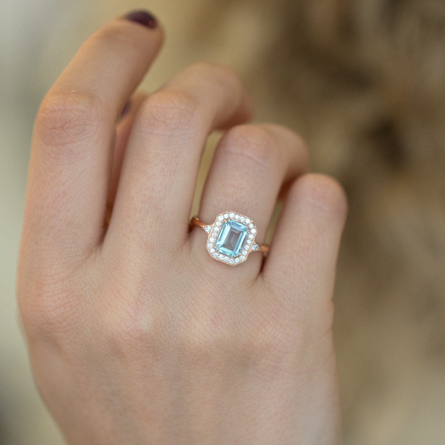 white gold halo ring with aquamarine